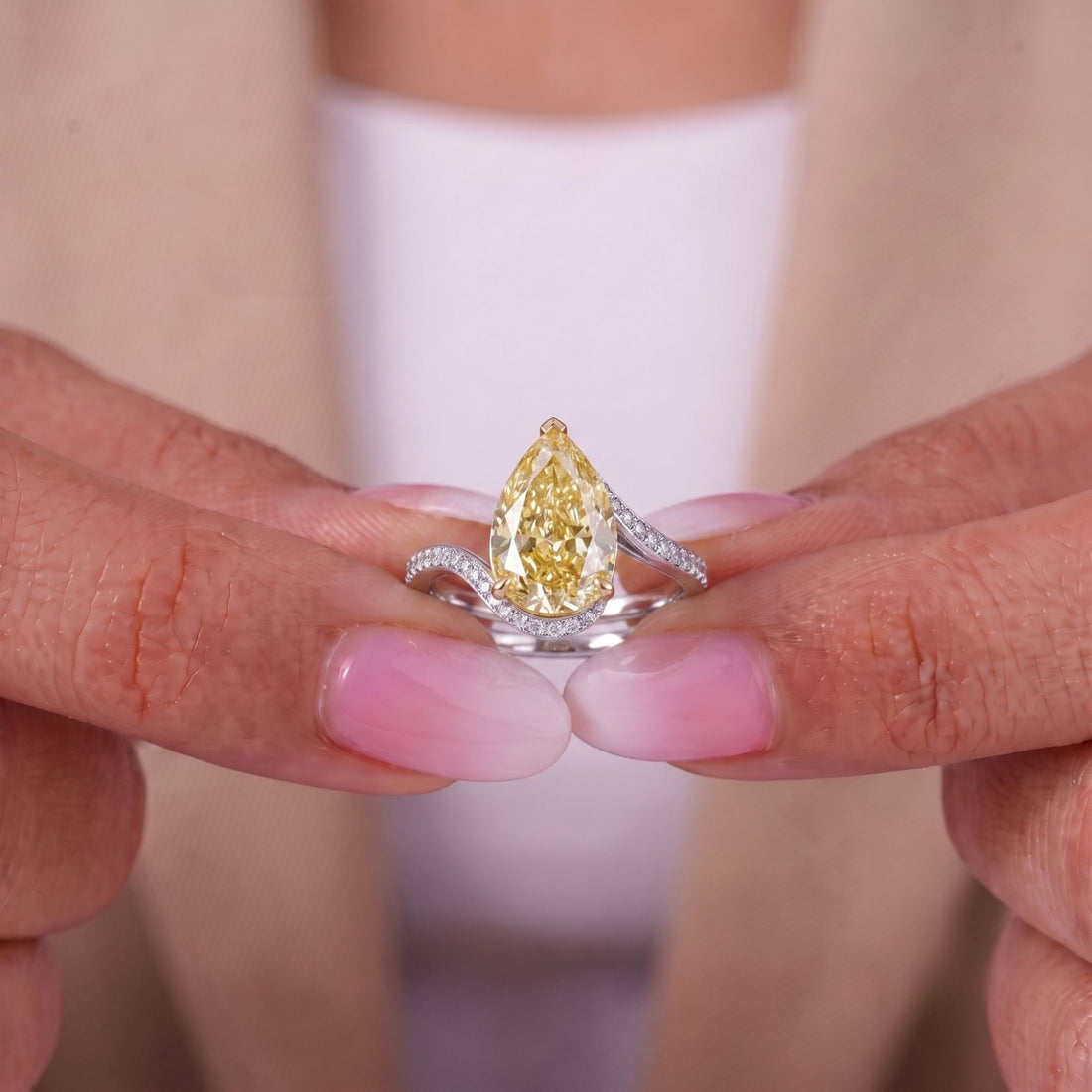 pear engagement ring with cathedral setting ring.
