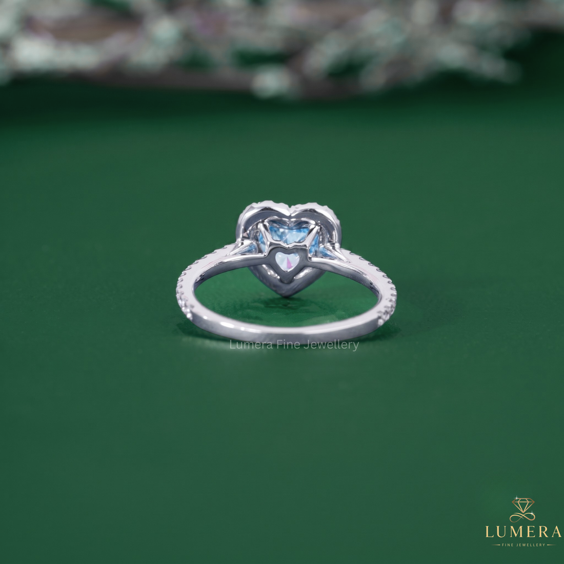 Halo diamond ring with blue diamond ring.