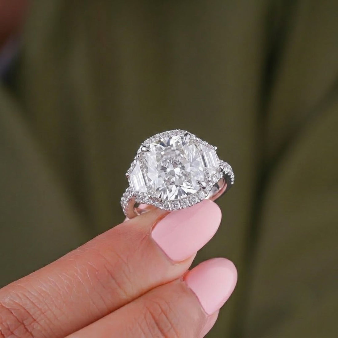 3 stone diamond engagement ring with 4 claw prong setting.
