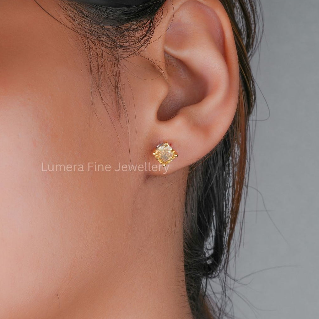 lab grown diamond with solid gold earrings.
