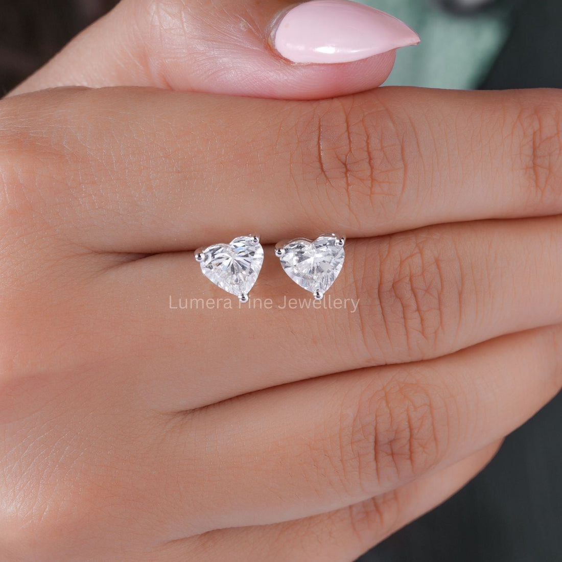 lumera earrings with heart diamond stud earrings.