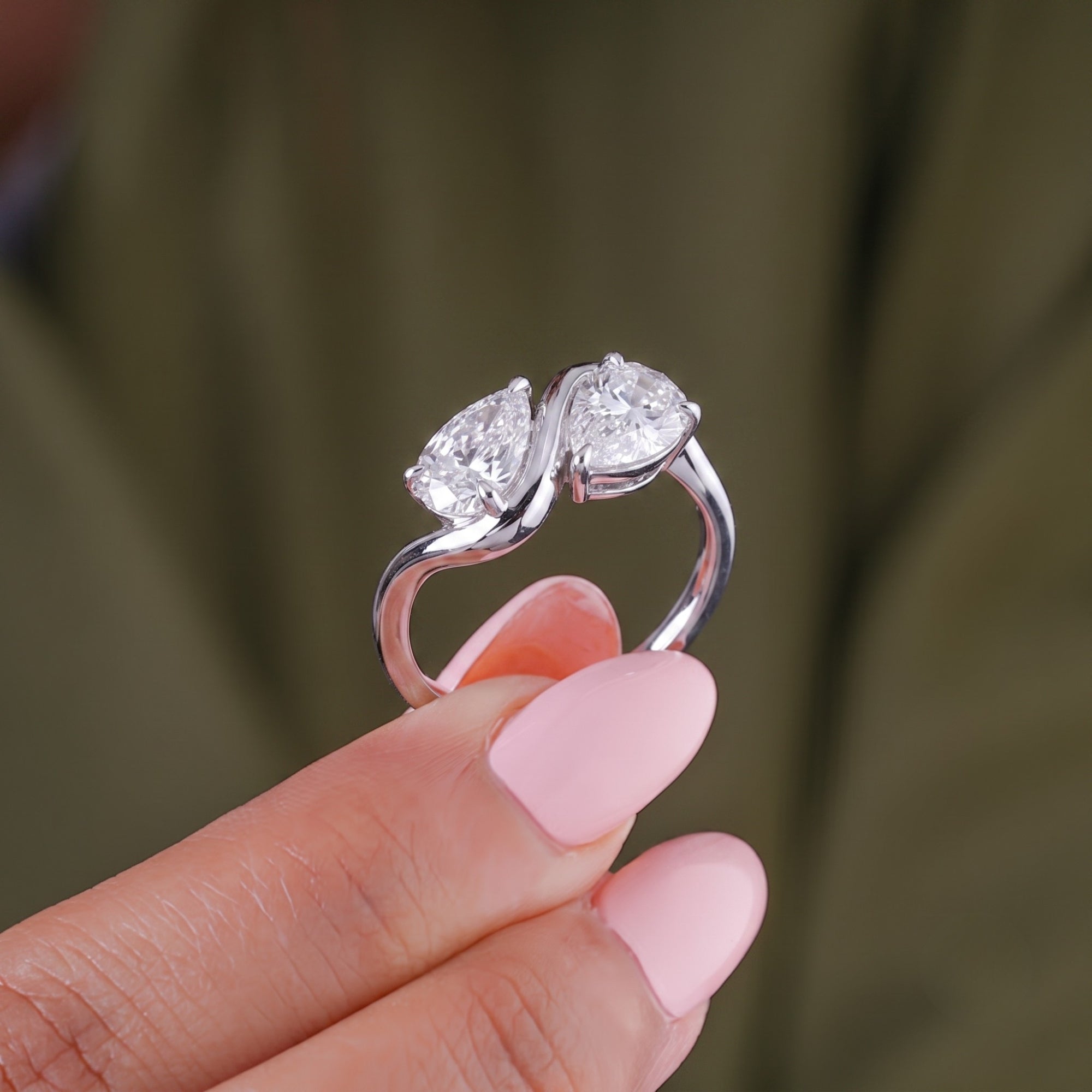 Pear diamond engagement ring with Almond engagement ring.
