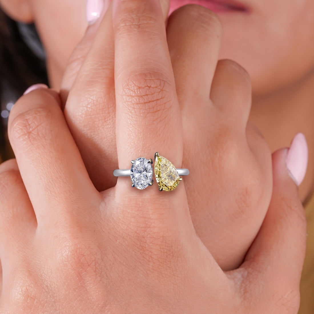pear engagement ring with yellow pear diamond.
