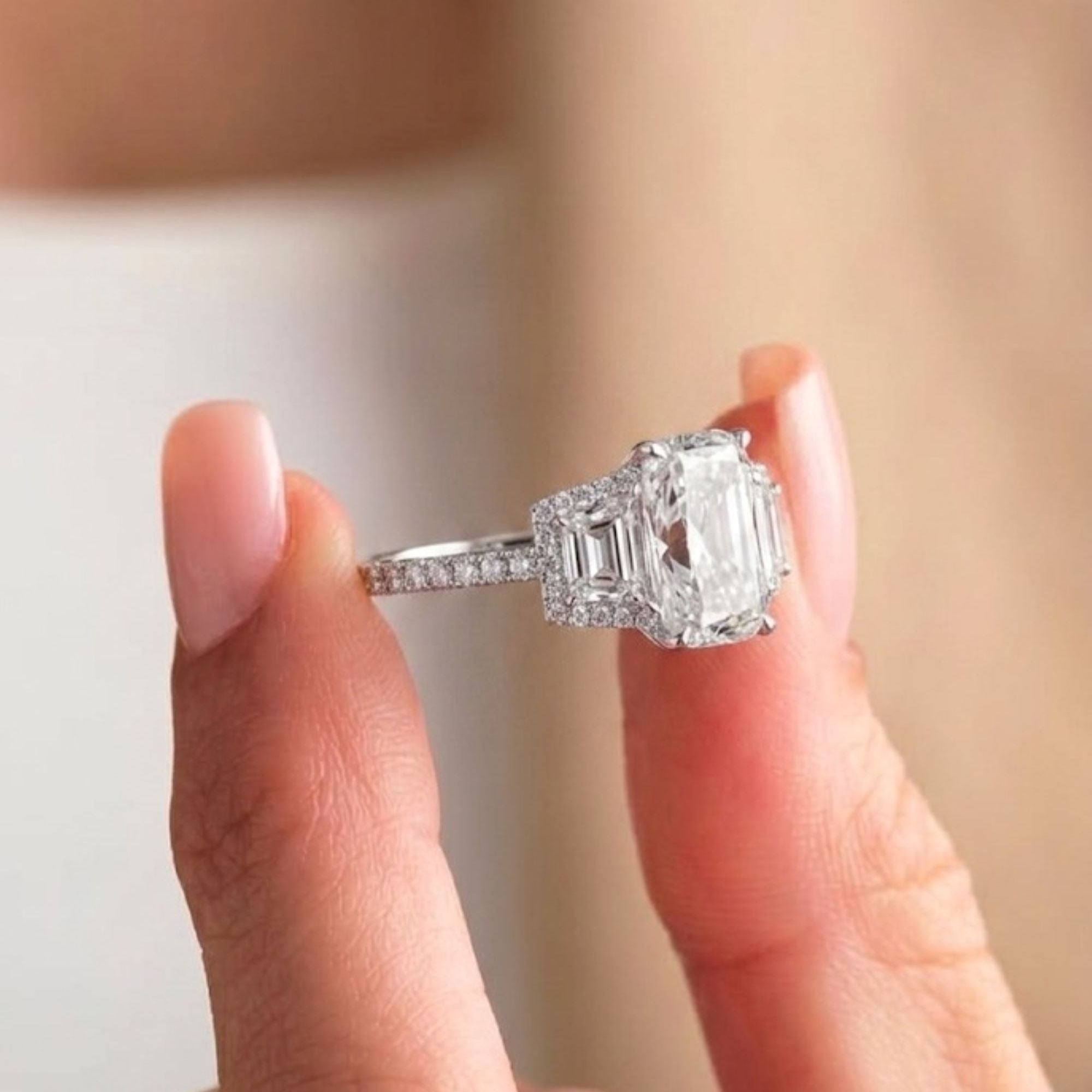 trapezoid diamond ring with claw prong ring.
