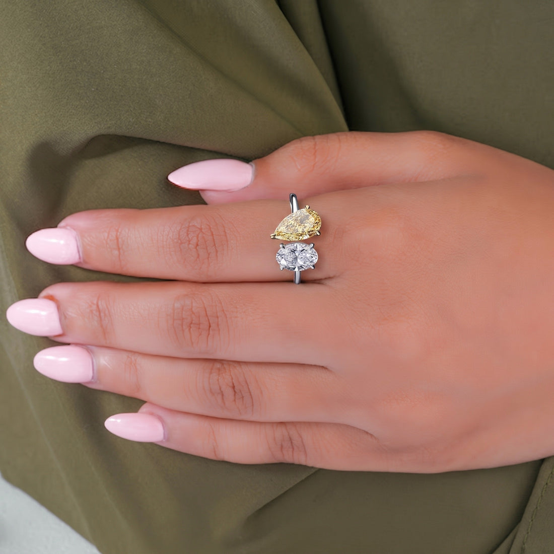 pear shape diamond ring with two tone diamond ring.
