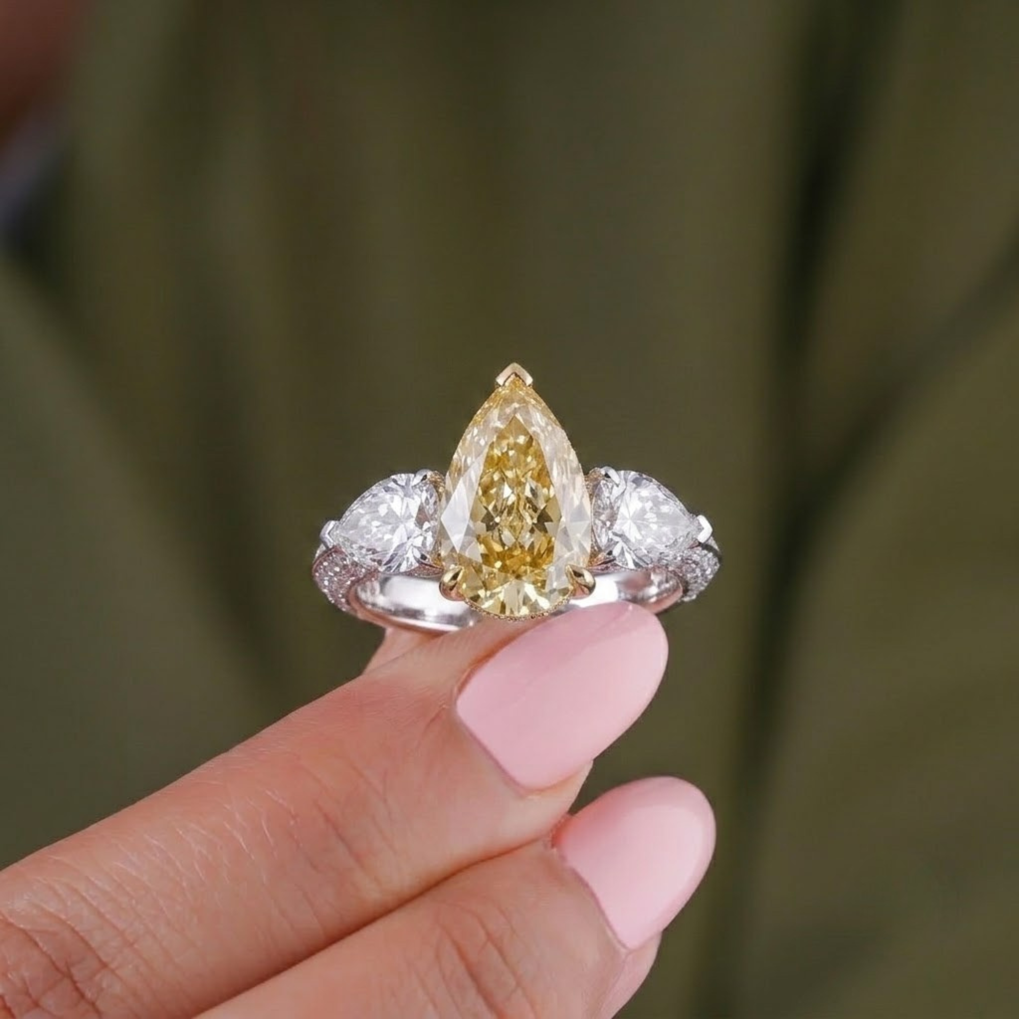 yellow diamond engagement ring with three stone engagement ring.
