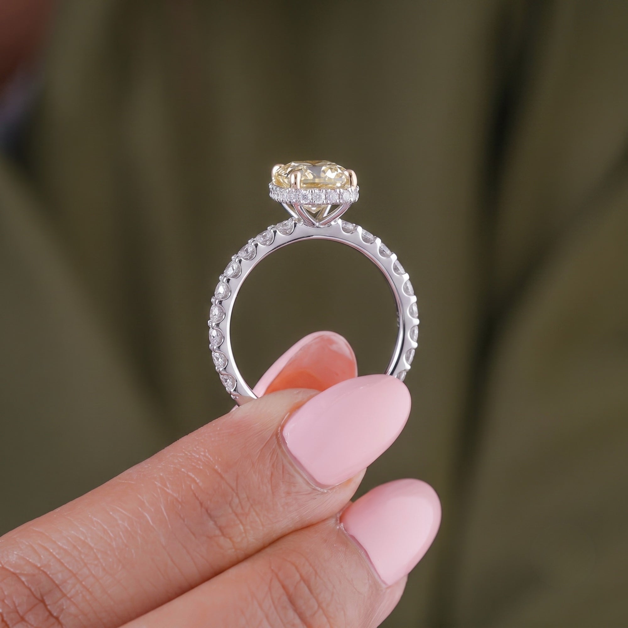 yellow oval diamond ring with hidden halo engagement ring.

