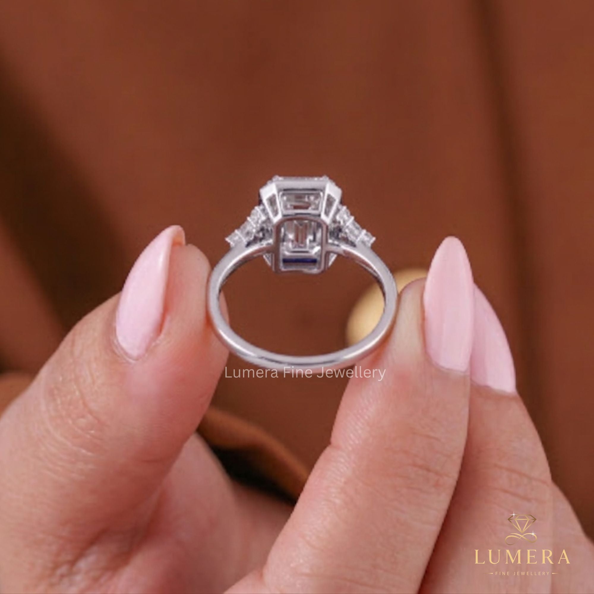 Emerald engagement ring with muse setting ring.
