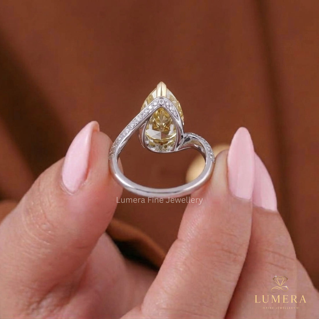 Two side row pave setting with two tone gold ring.
