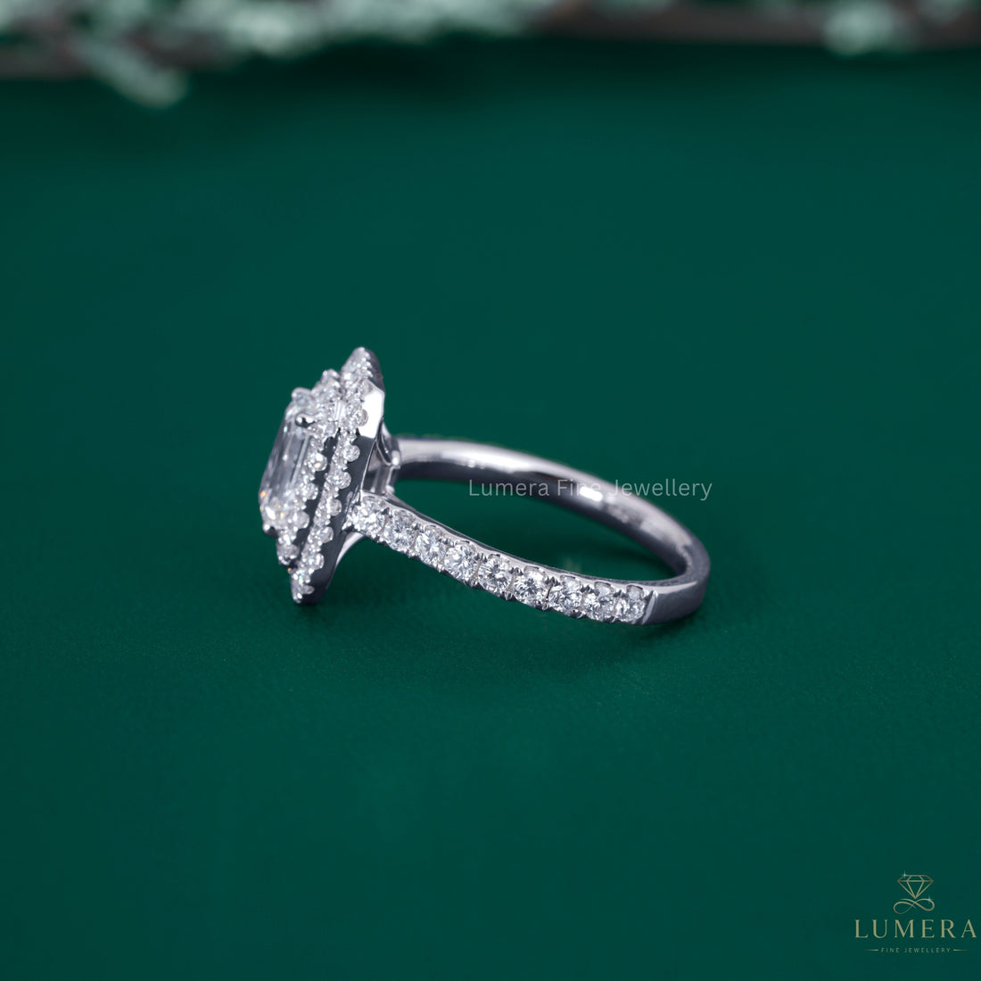 Double halo ring with round prong setting.