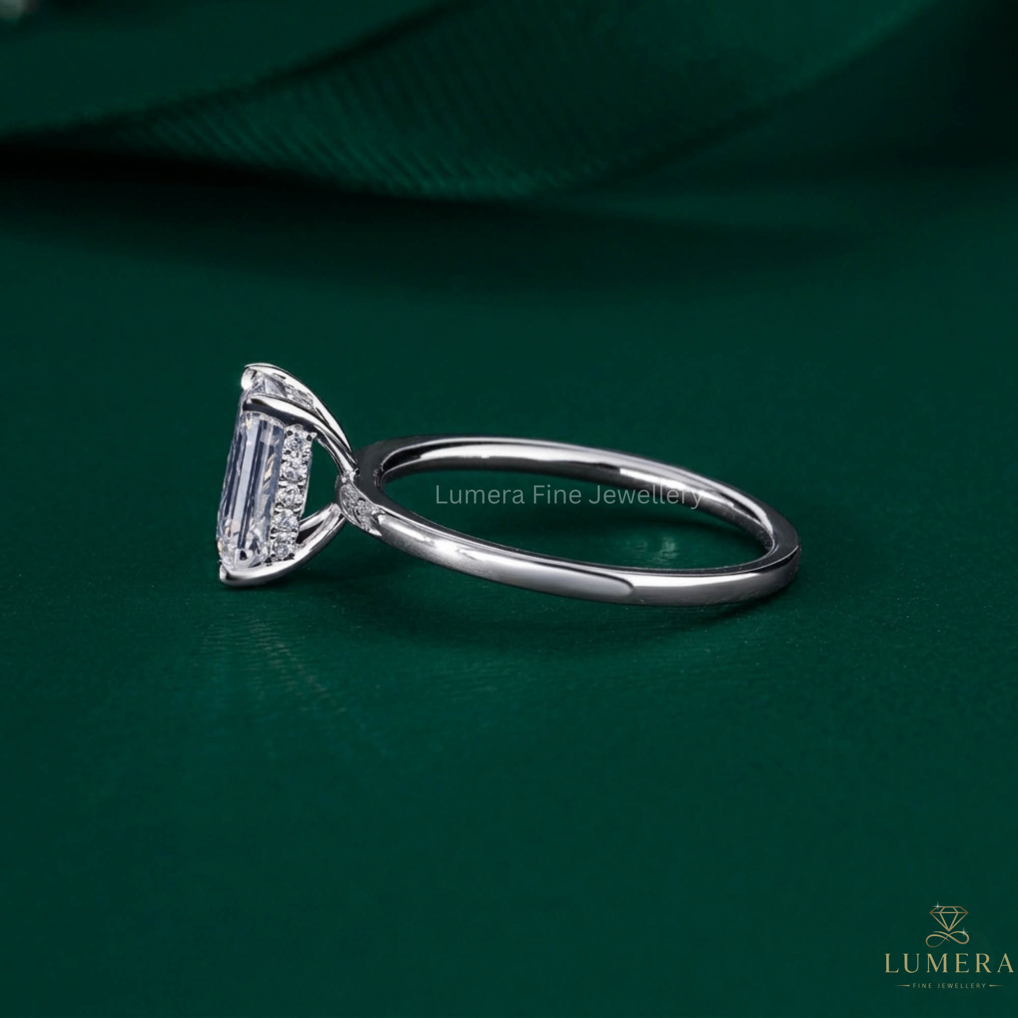 emerald cut solitaire engagement ring on hidden halo ring.
