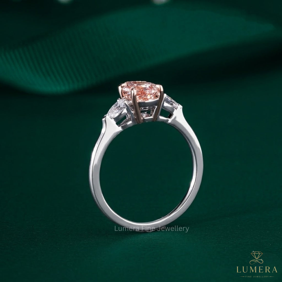 5 claw prong setting with pear side stone.
