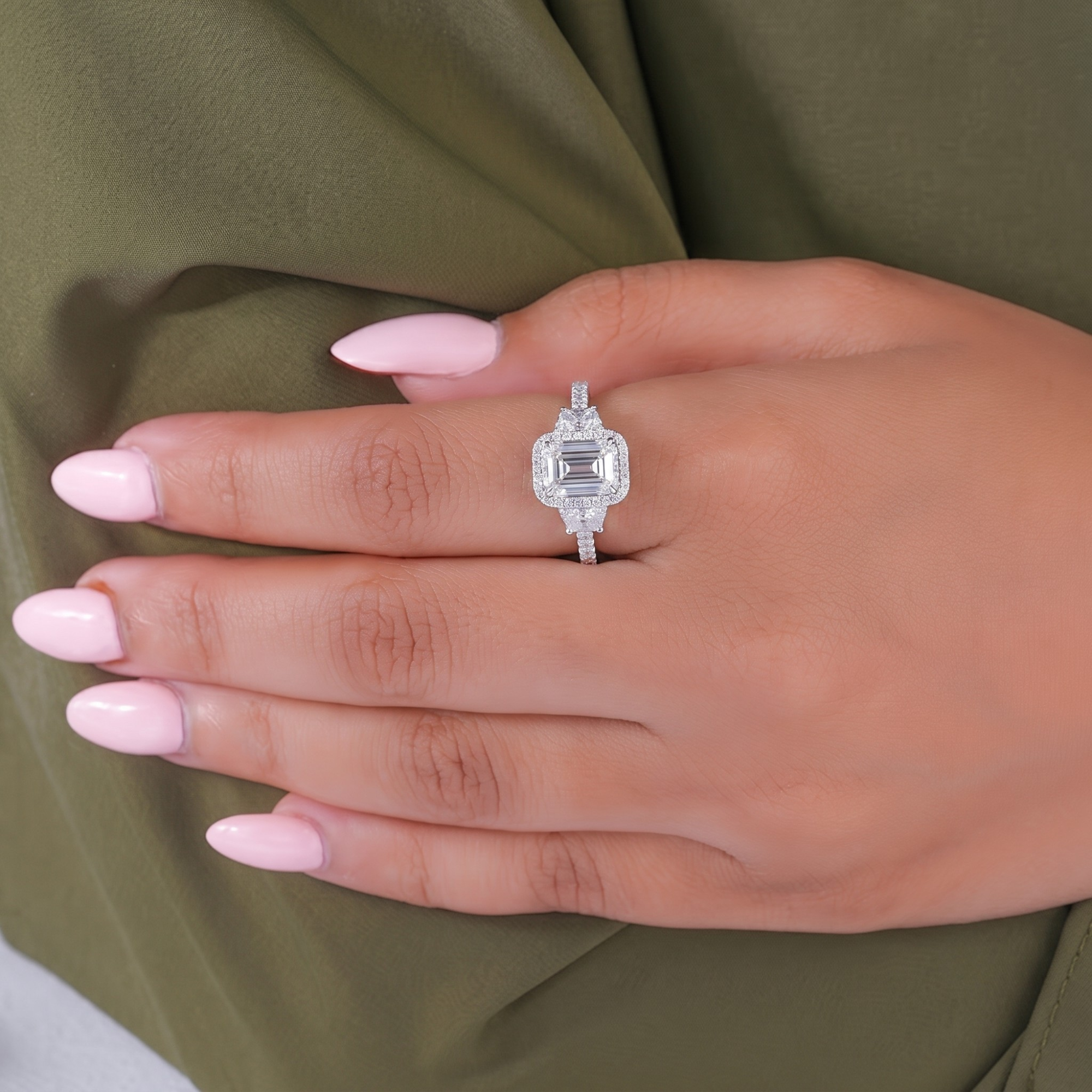 Lumera diamond ring with emerald engagement ring.