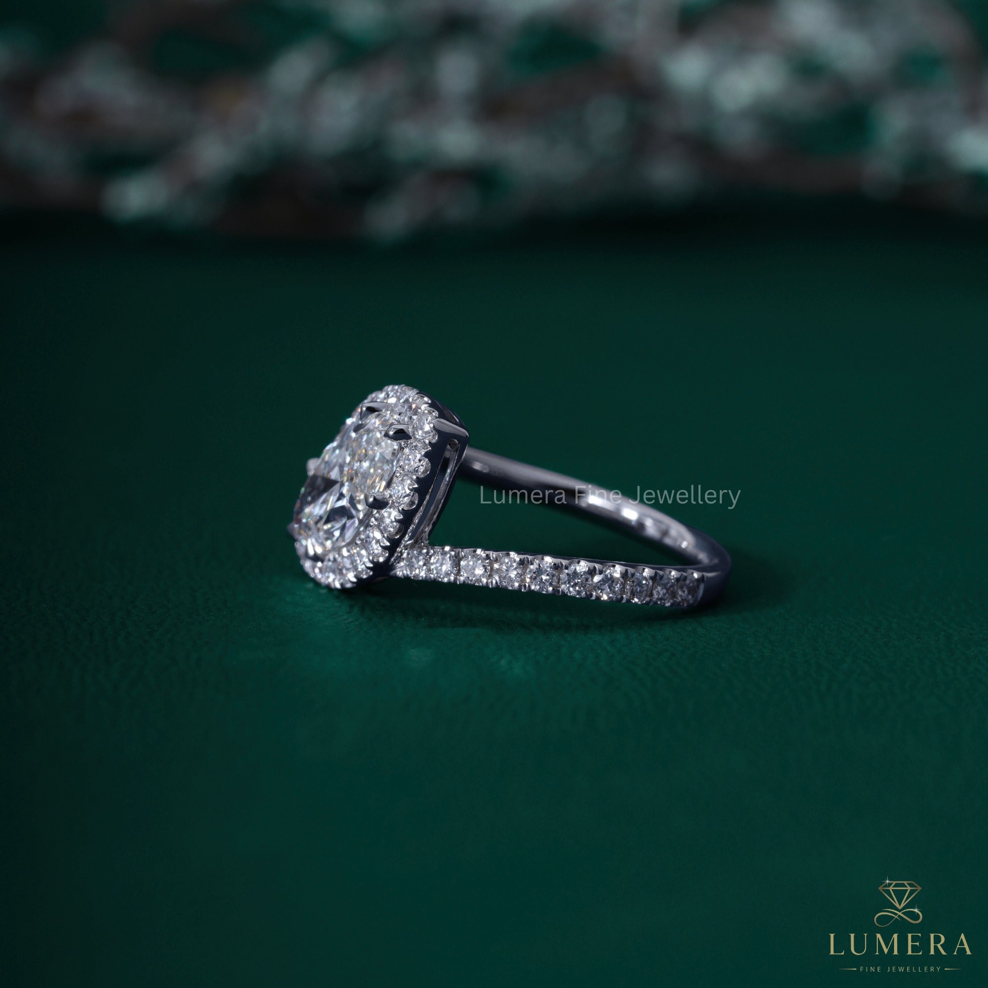Marquise cut ring with east west halo setting.