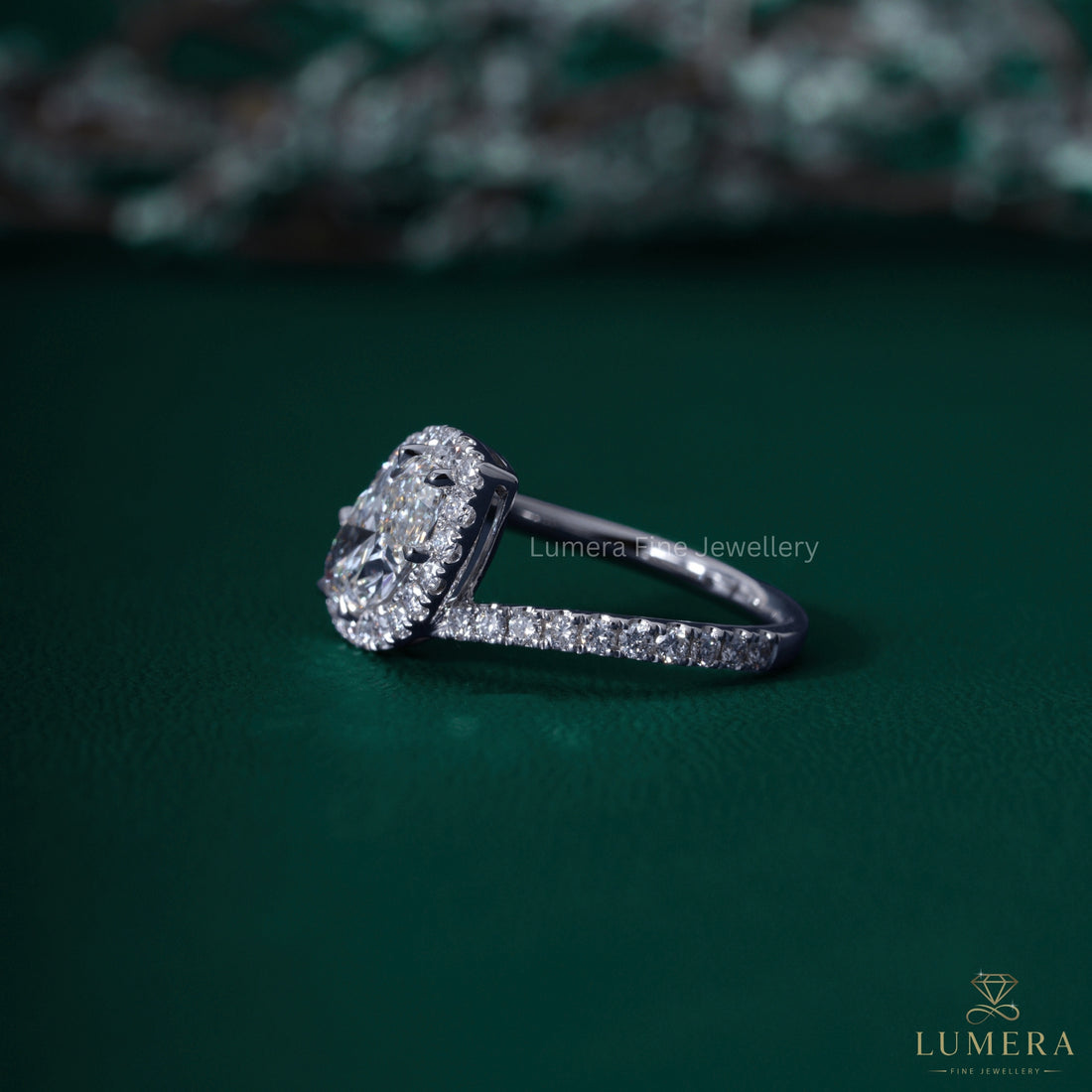 Marquise cut ring with east west halo setting.