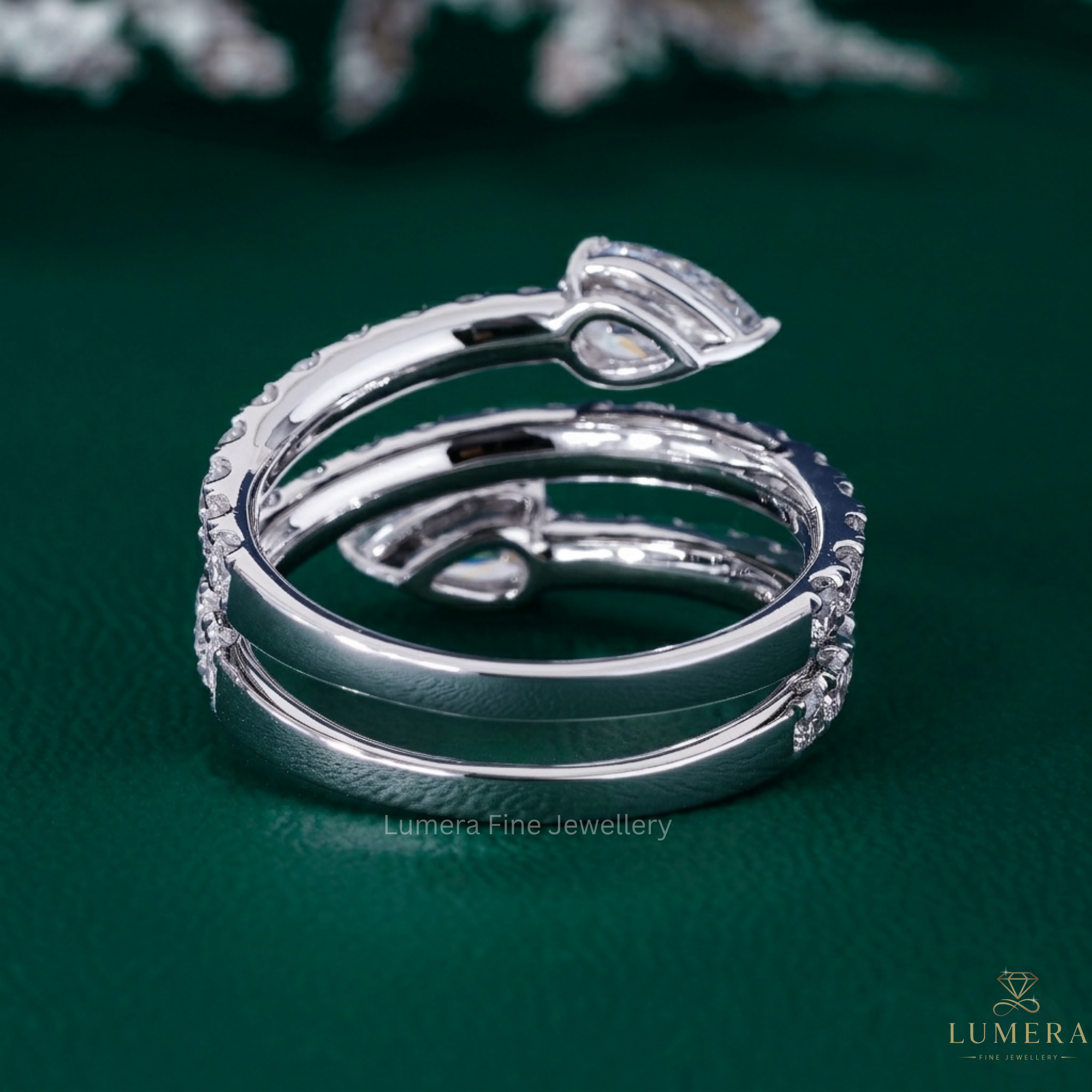 pear cut wedding band with two stone spiral band.
