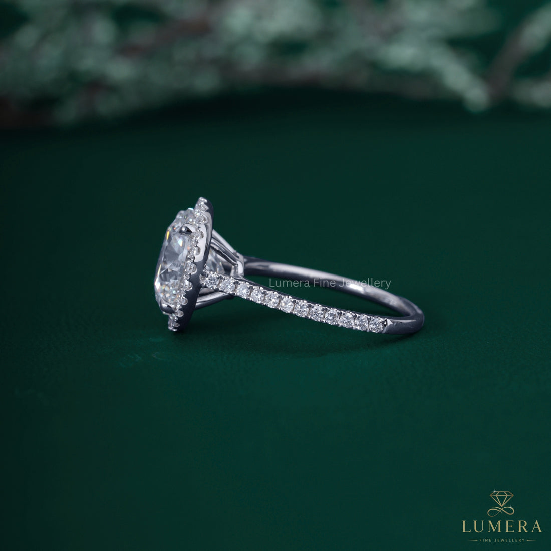 Round cut engagement ring with round cut halo ring.