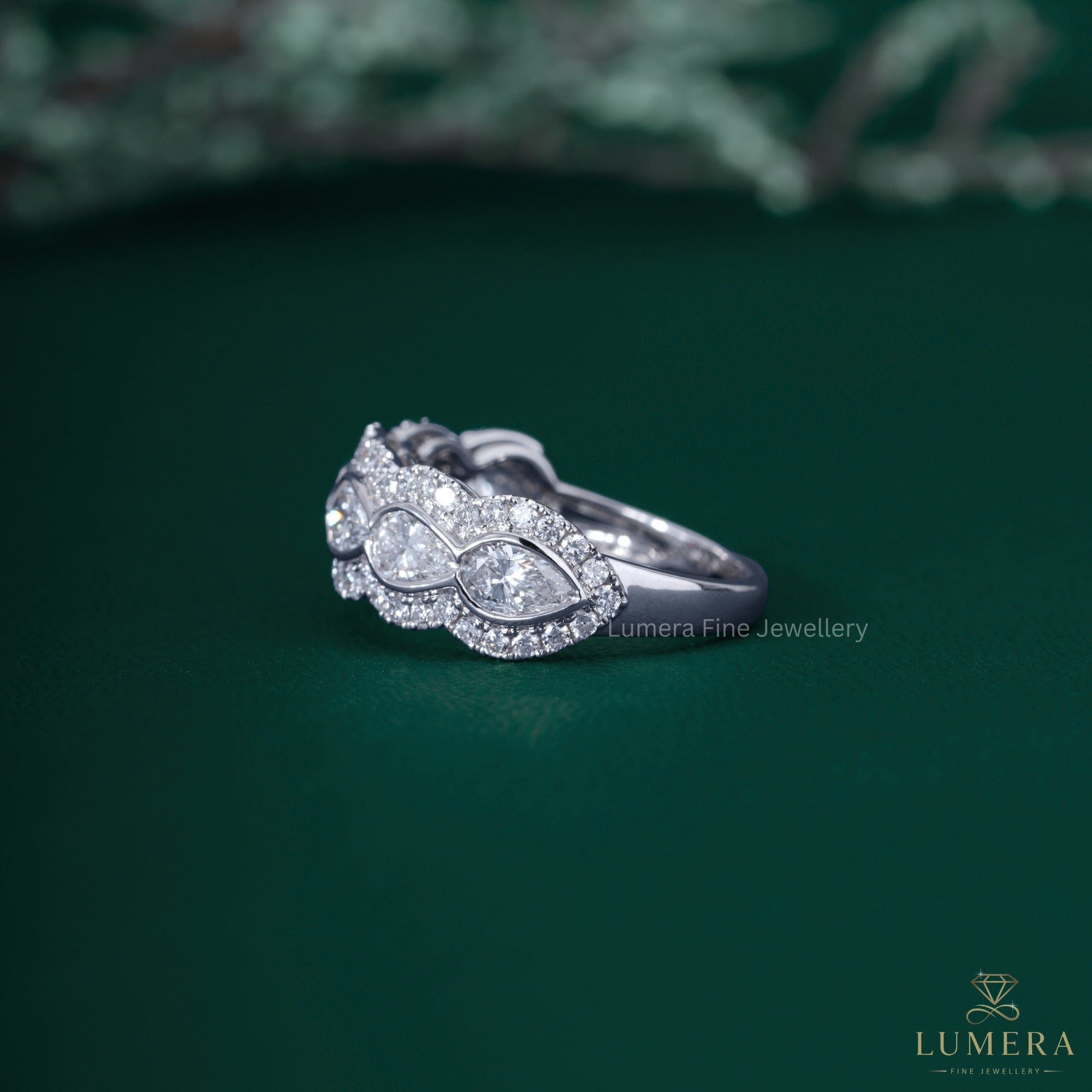 Almond shape band with halo diamond band.