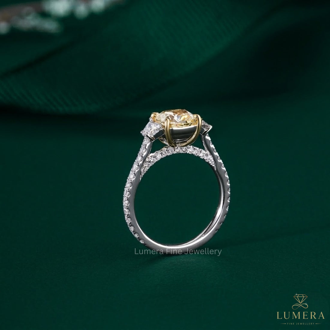 3-stone cushion engagement ring with trapezoid side stone