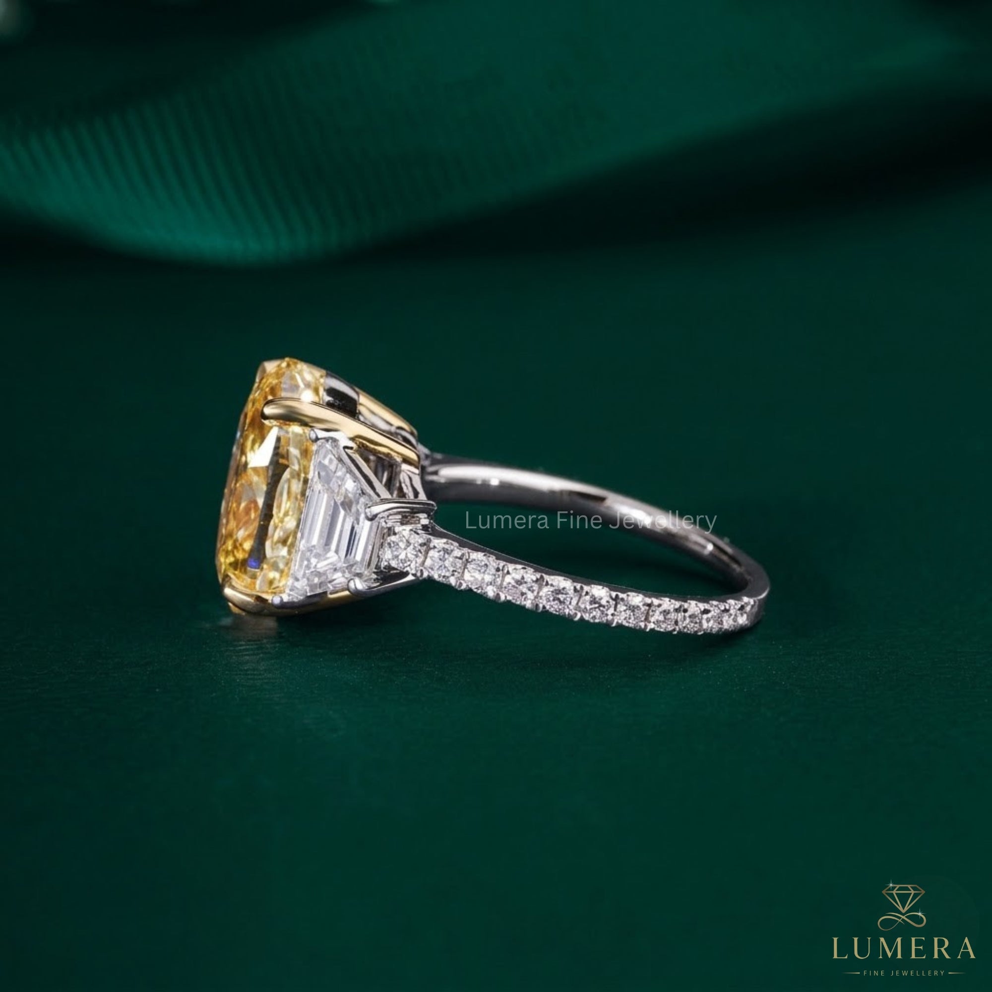 yellow oval diamond ring with two tone gold ring.