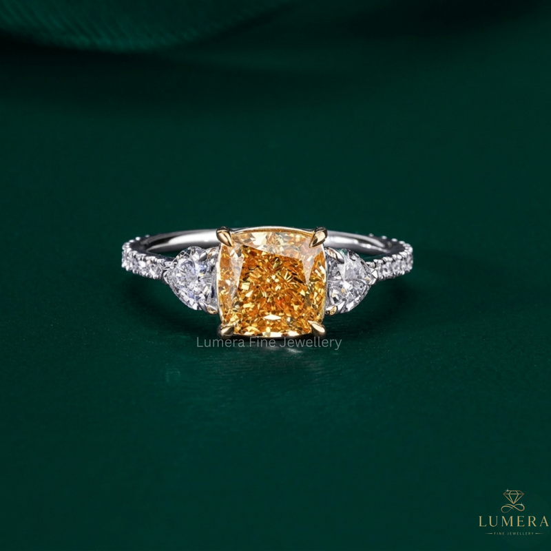 cushion diamond engagement ring with three stone engagement ring.
