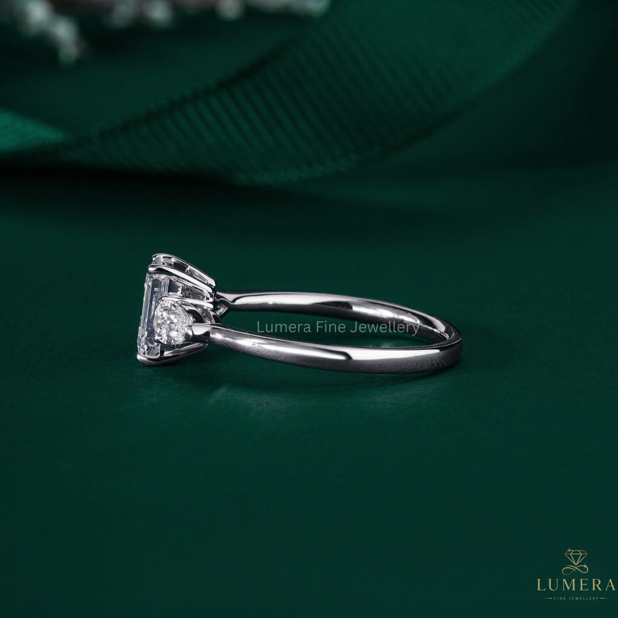 emerald and pear diamond ring with solid gold ring.
