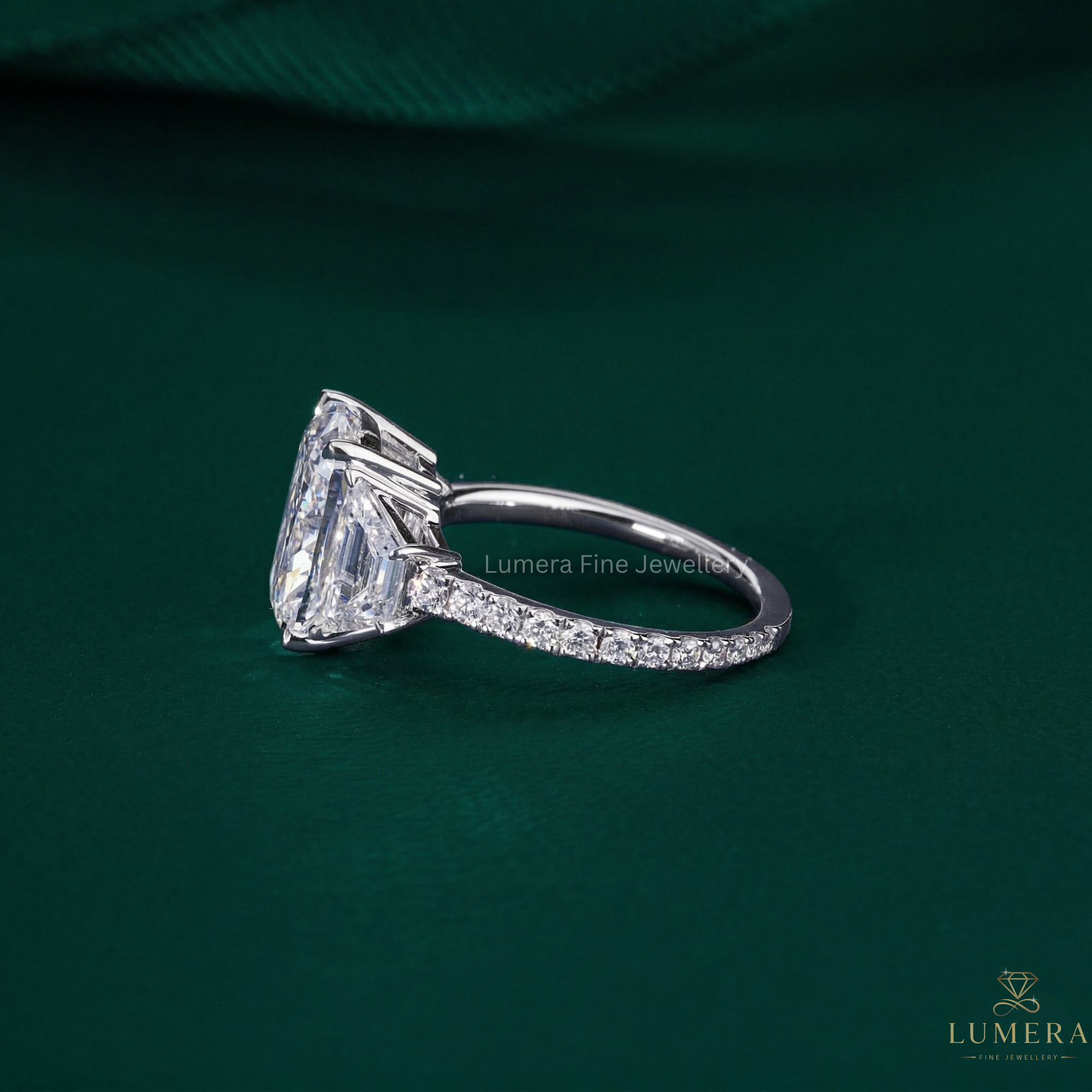 trapezoid side stone with pave setting ring.
