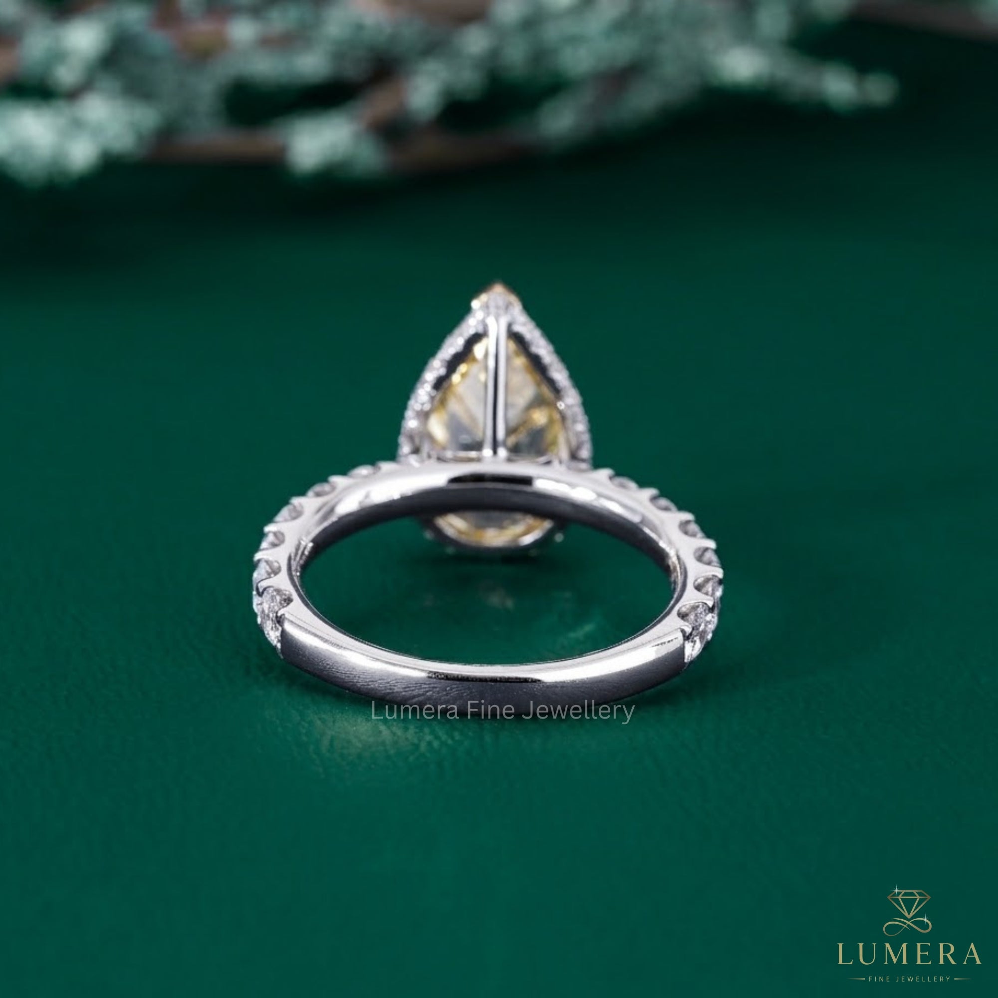 pear shaped engagement ring with claw and V prong setting.