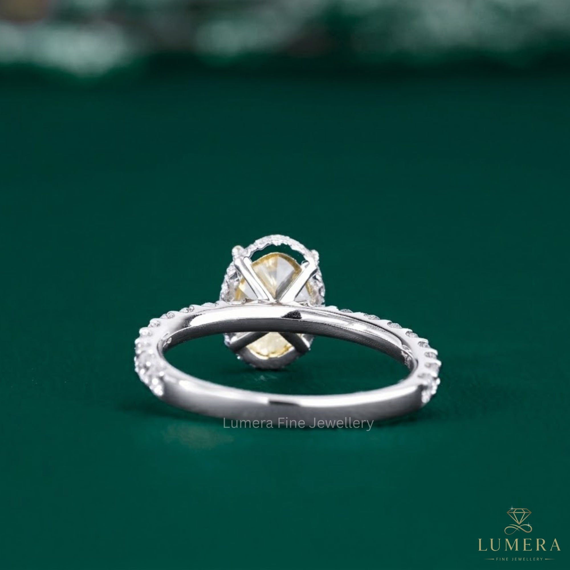 oval diamond engagement ring with claw prong setting.