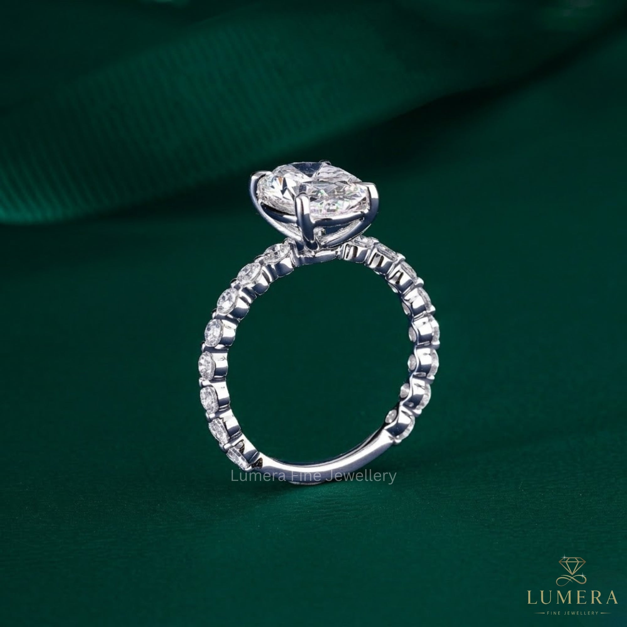 oval diamond engagement ring with 4 claw prong setting.