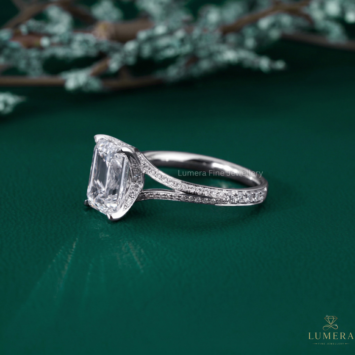 gold emerald cut engagement ring with split shank engagement ring.