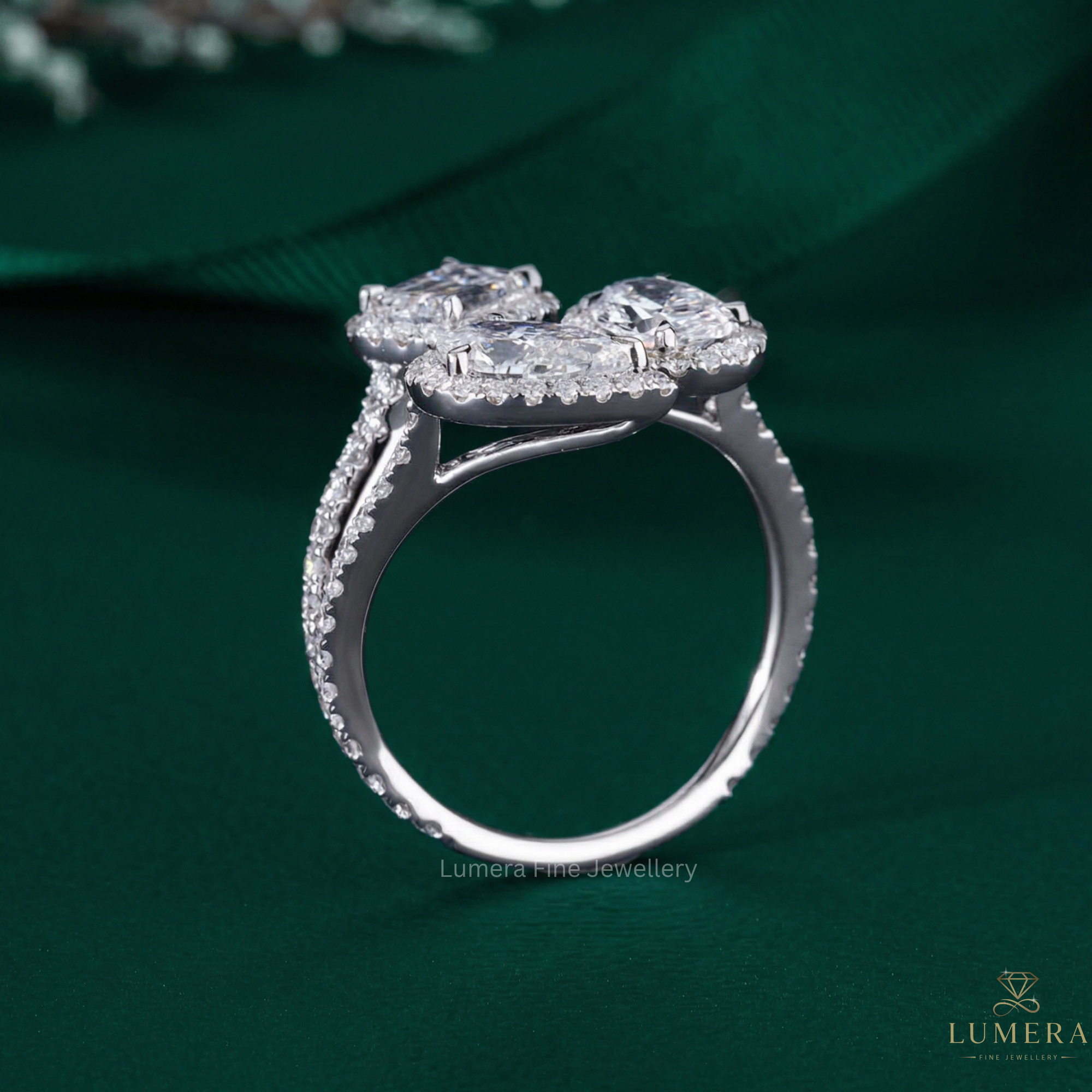 oval pear and emerald diamond ring with emerald diamond ring.