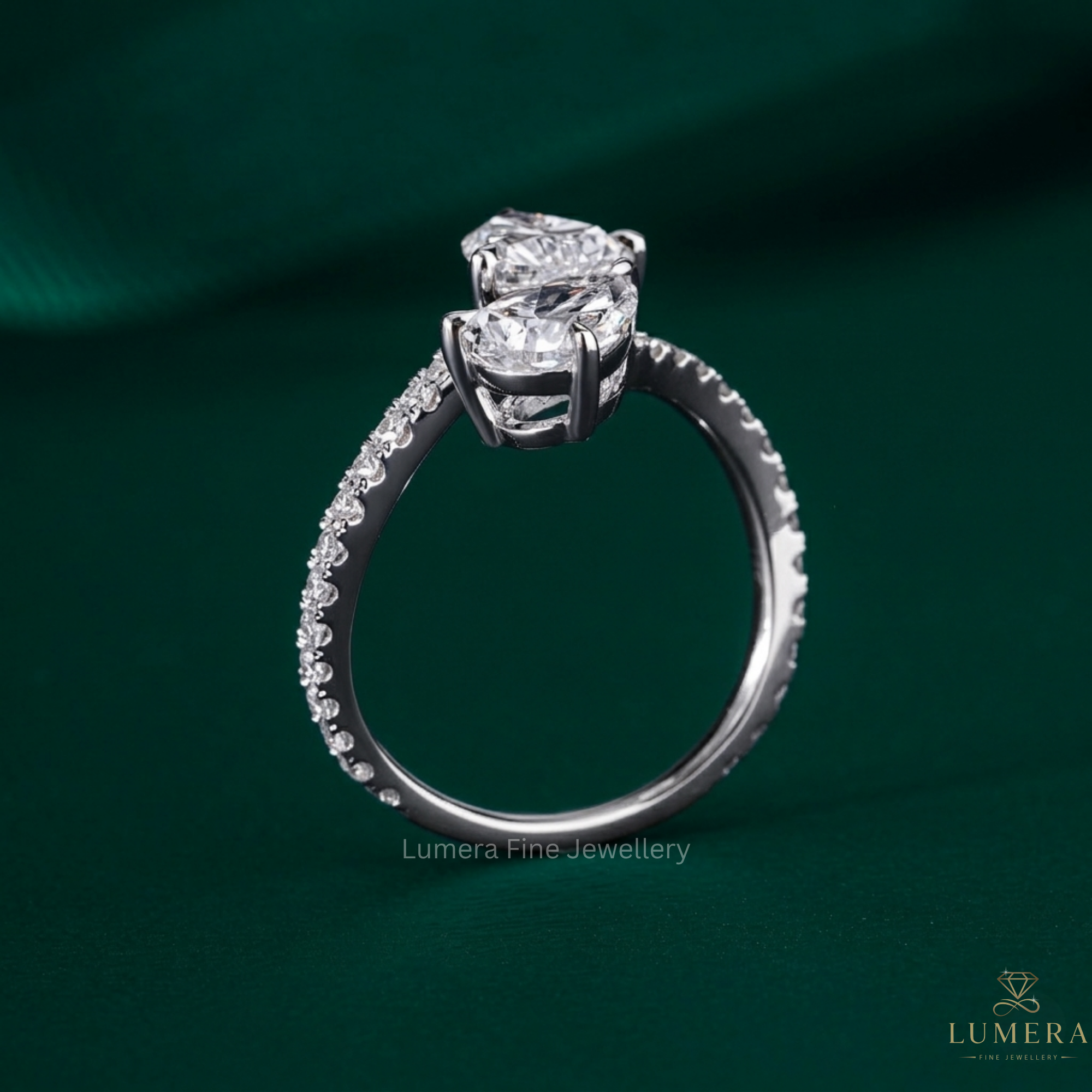 pear engagement ring with pave setting.
