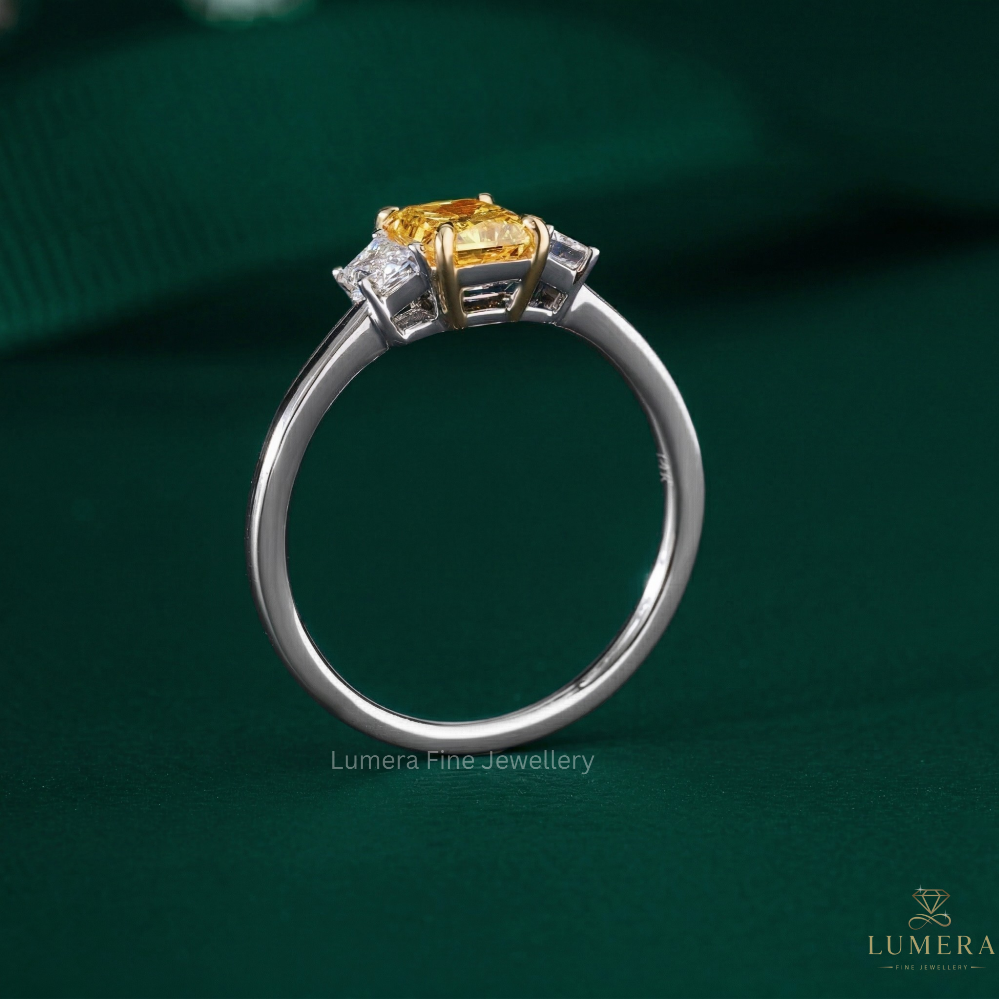 three stone ring with trapezoid side stones.