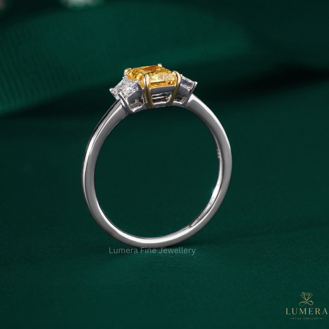three stone ring with trapezoid side stones.