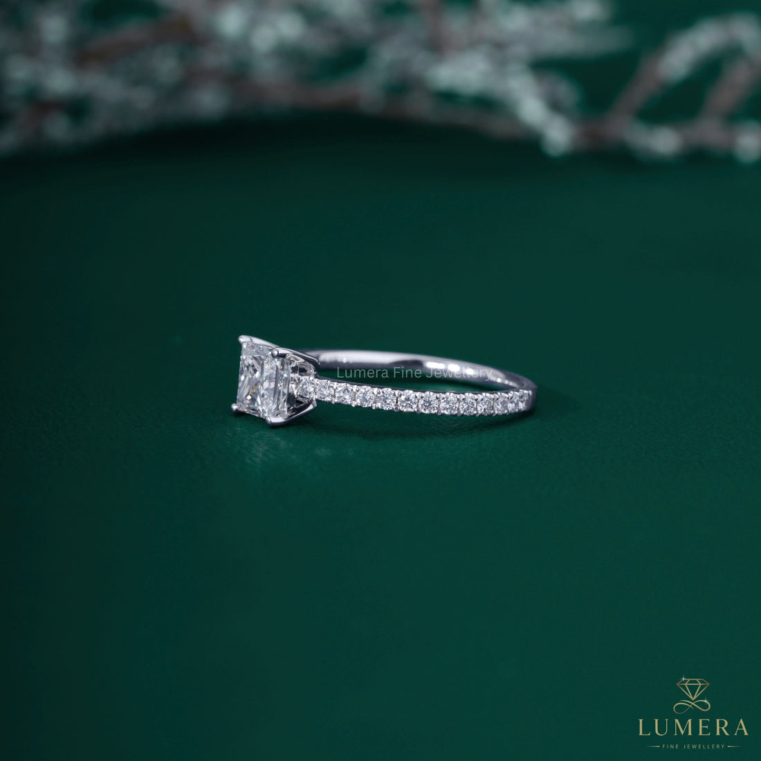 Princess diamond ring with round prong setting.