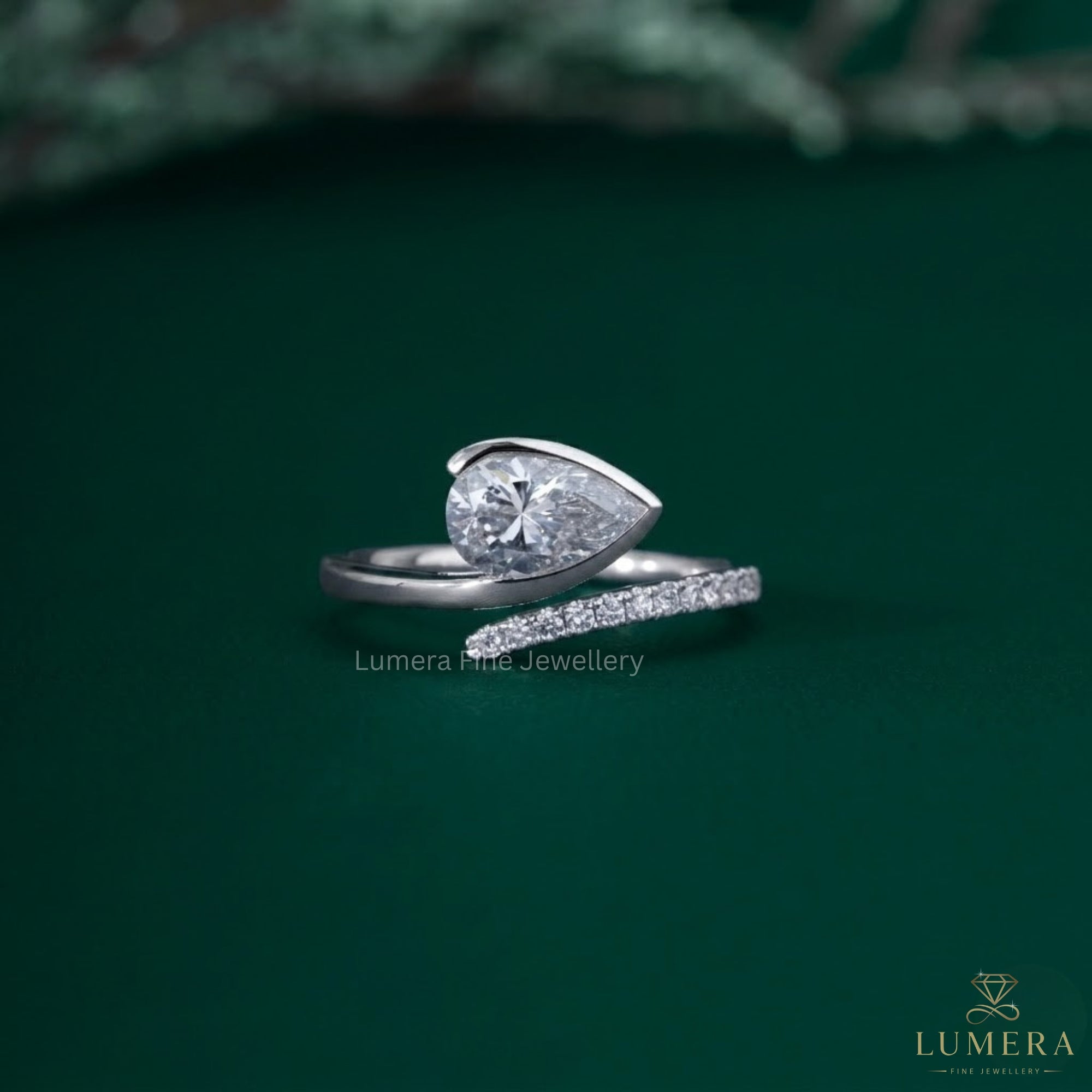 Pear shaped engagement ring with Teardrop diamond ring.