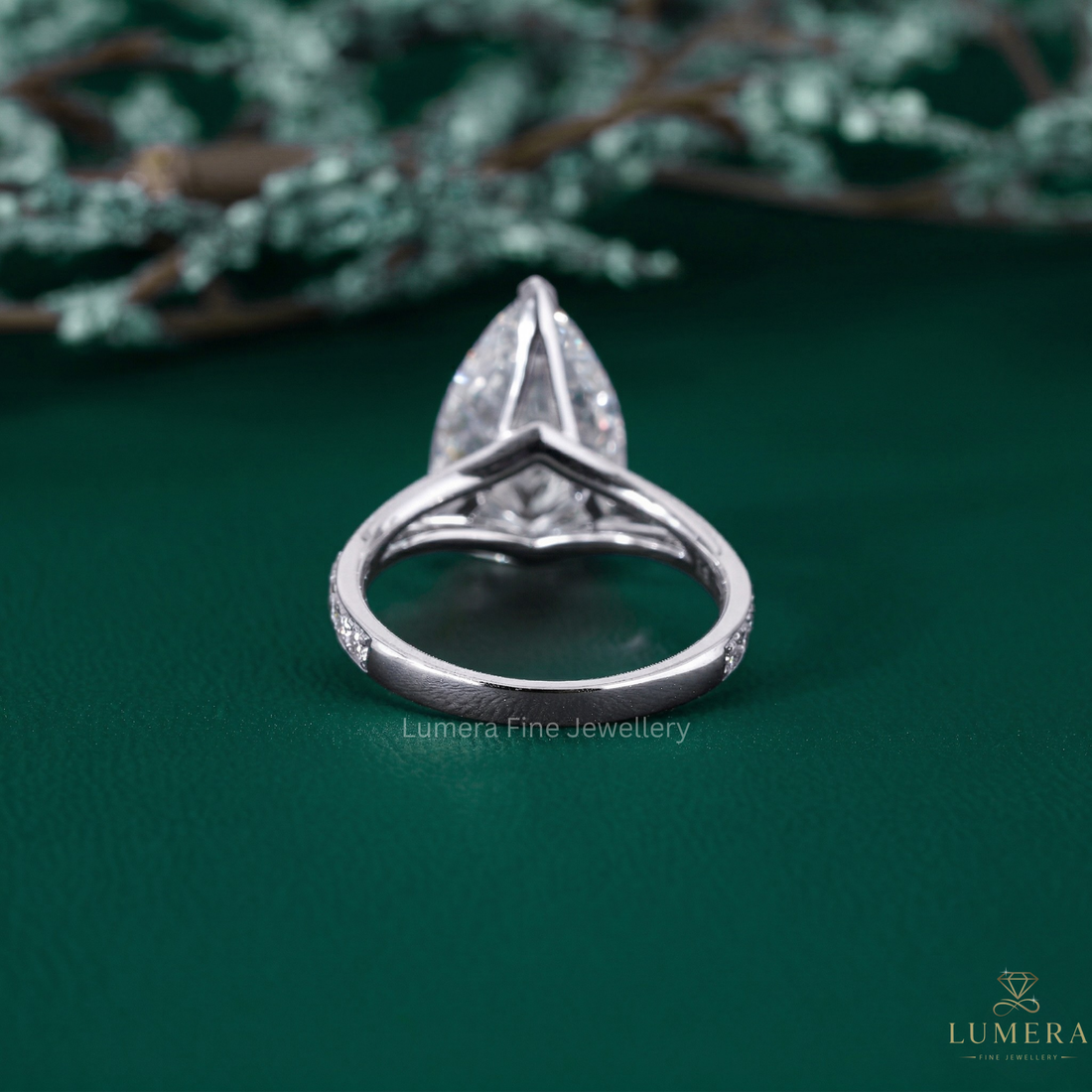 split shank engagement ring with wrap pave set.