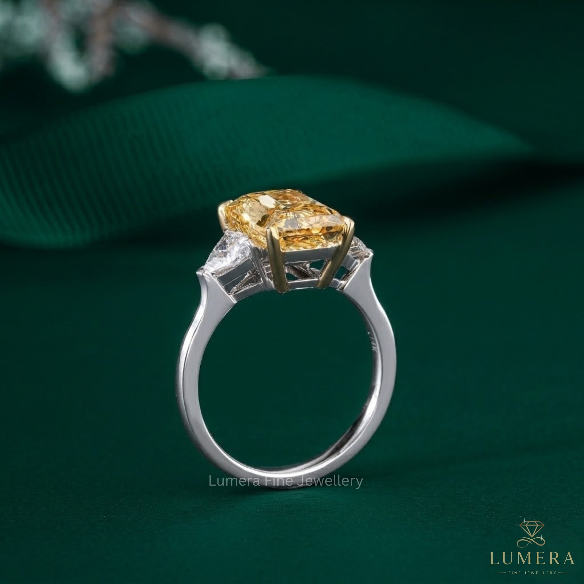 yellow Diamond Ring in yellow diamond three stone ring style.
