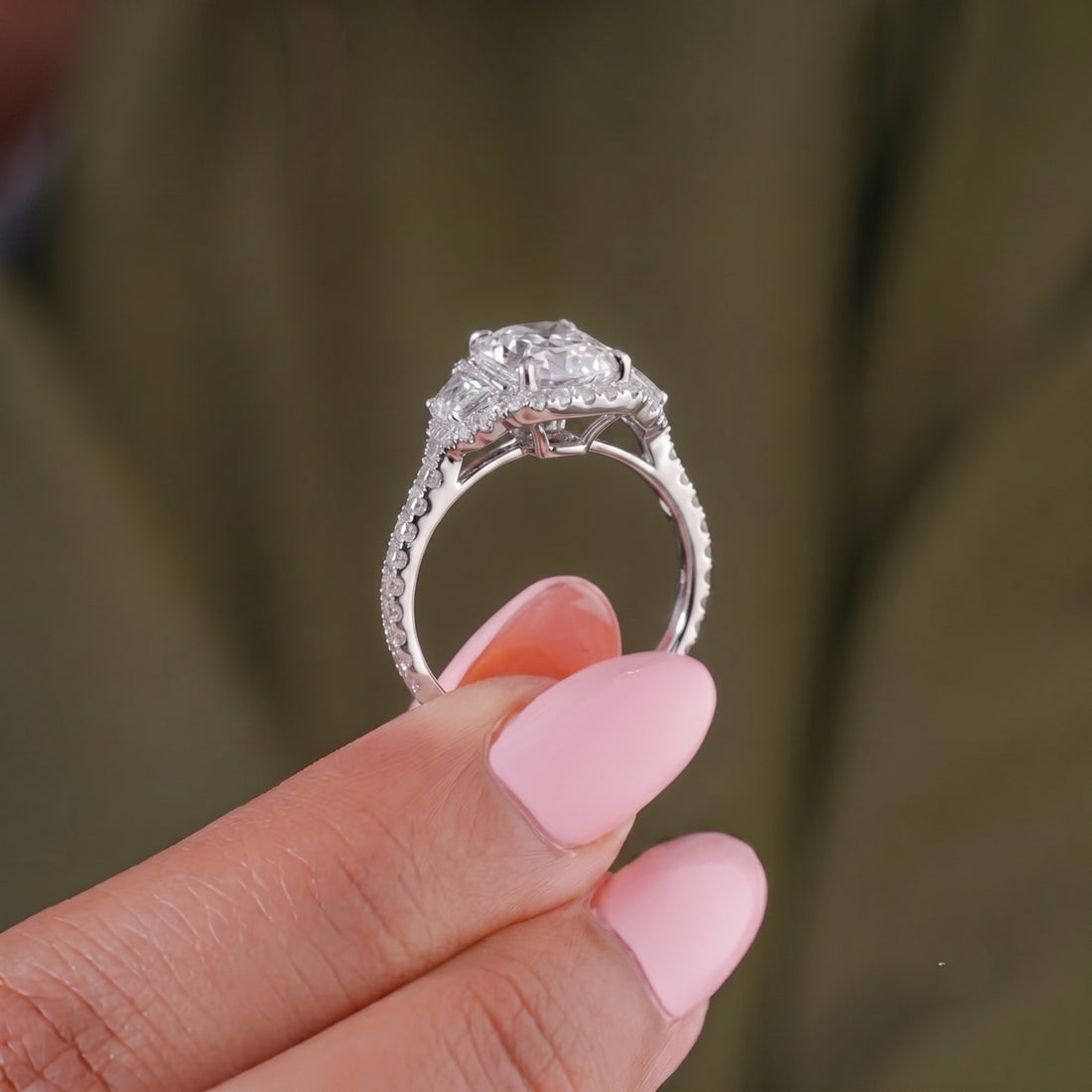 4 claw prong ring with three stone engagement ring.
