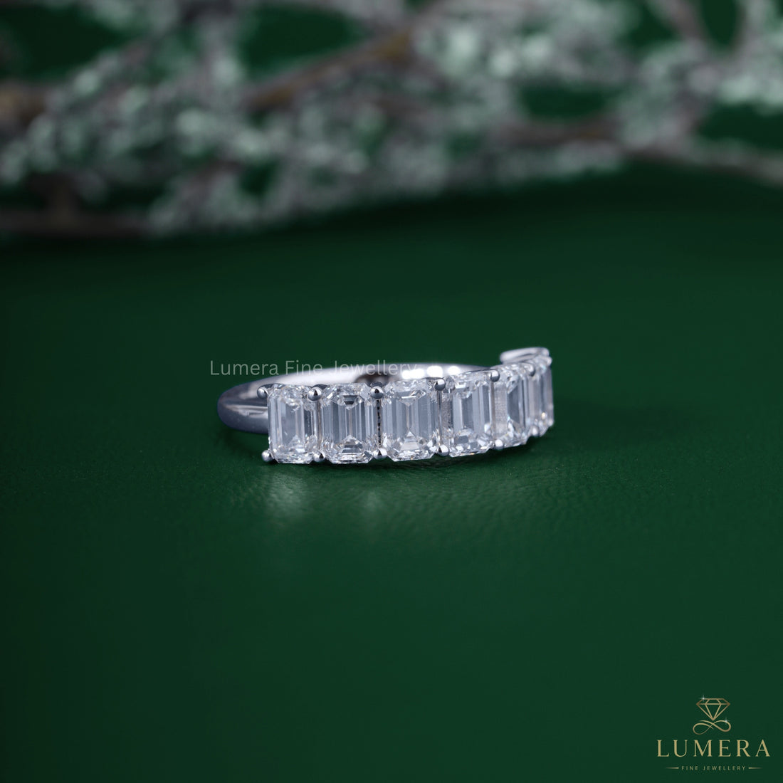Half eternity wedding band with emerald eternity band.