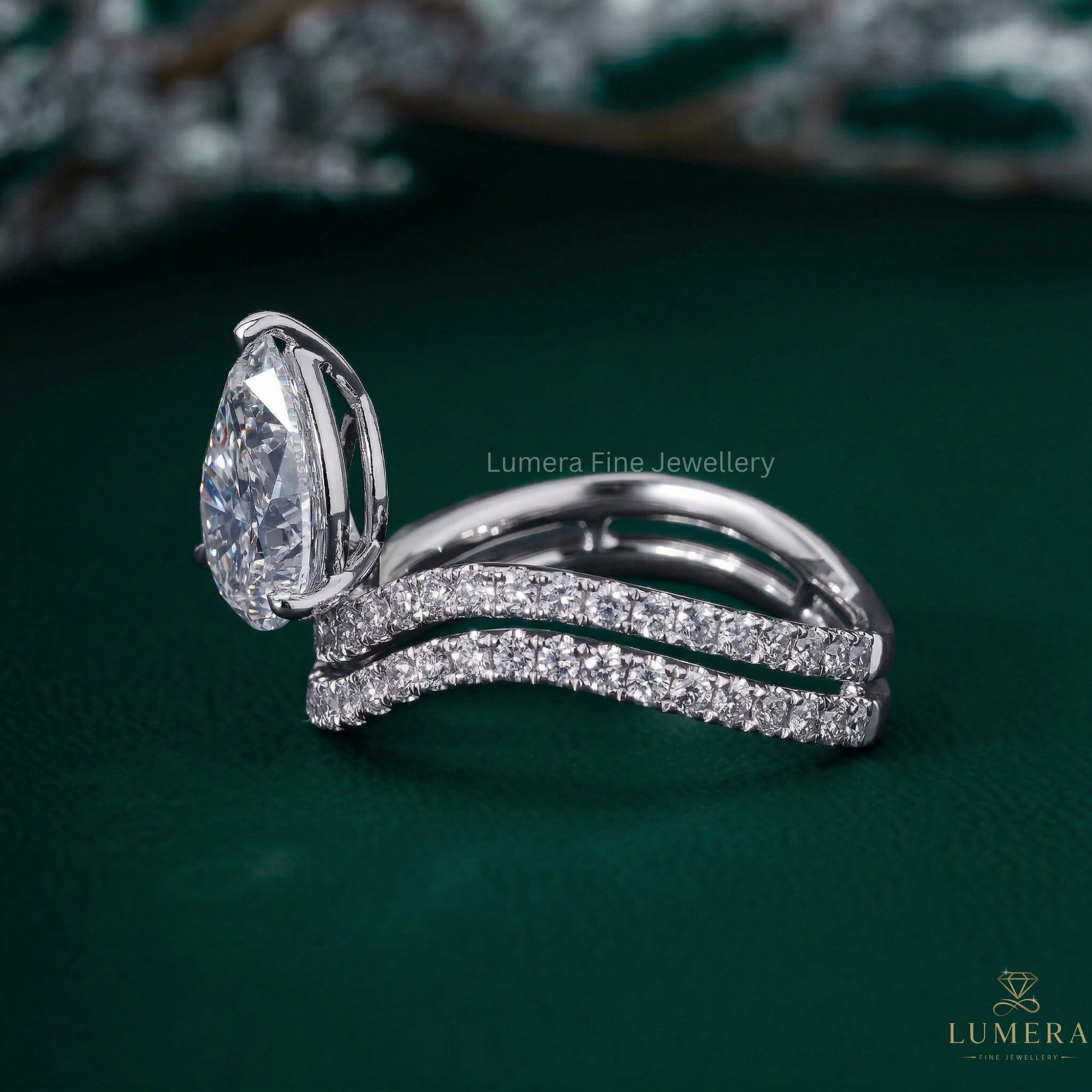 Pear shaped engagement ring with Pear pave engagement ring.