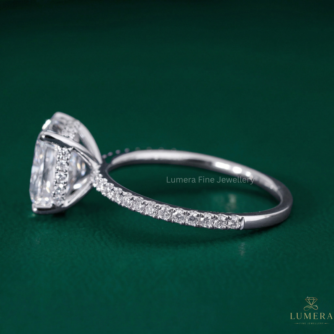 cushion engagement ring with pave diamond ring.