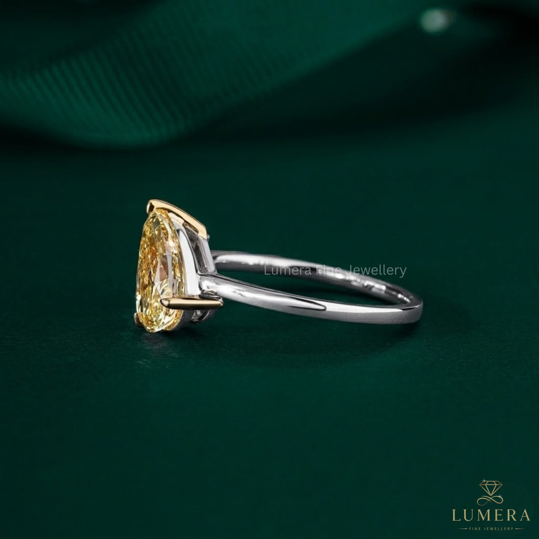 oval and pear engagement ring with two stone engagement ring.