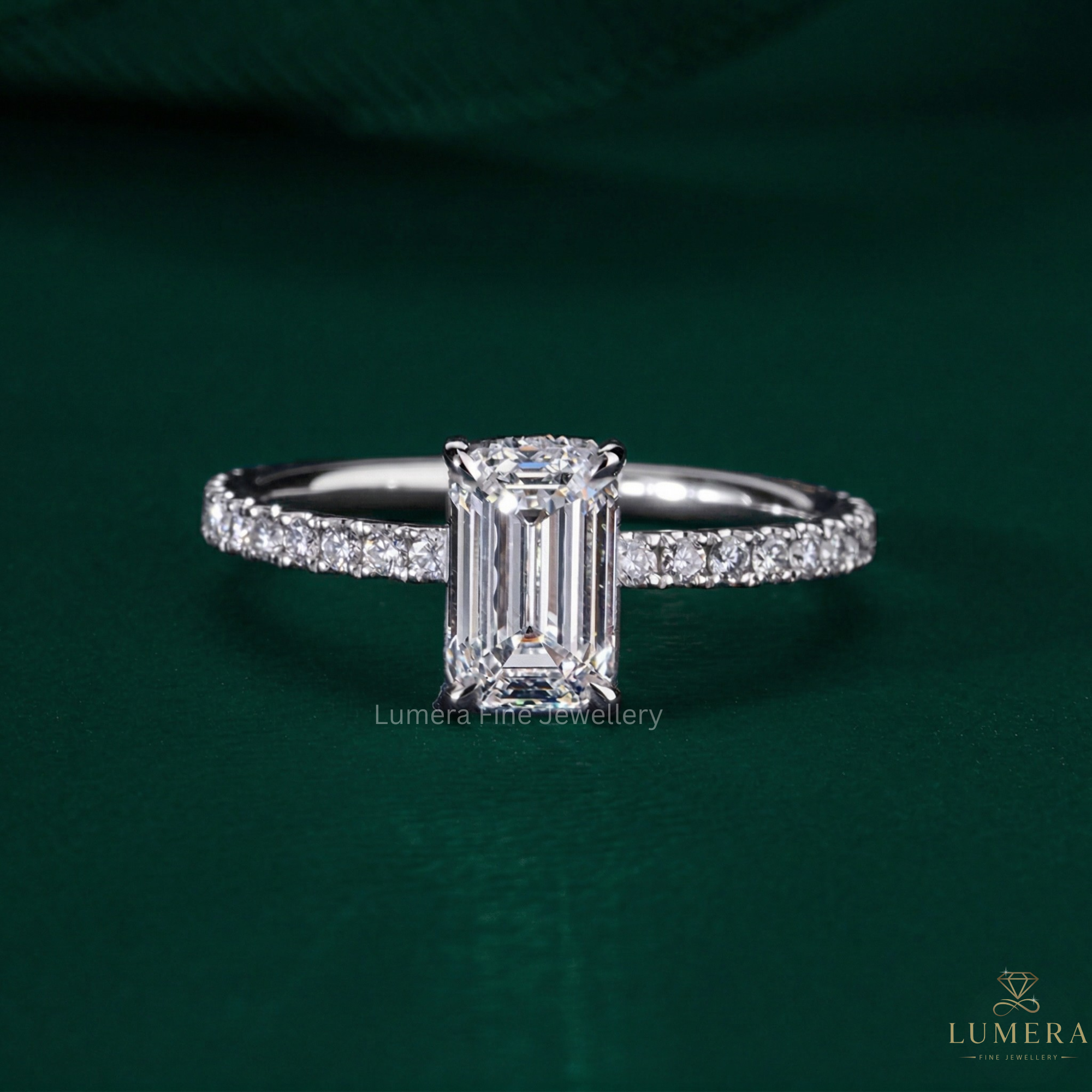 emerald cut engagement ring with pave set ring.
