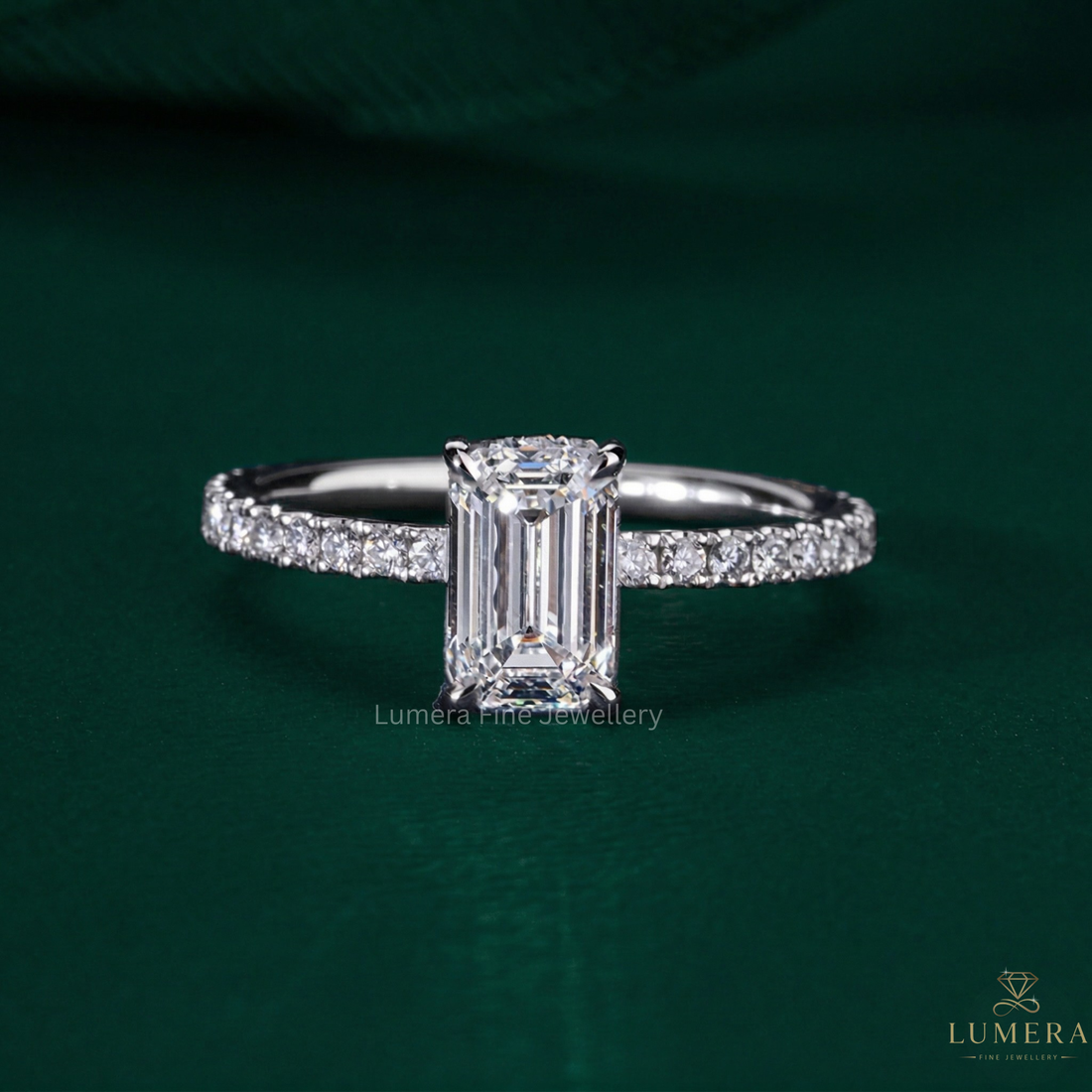 emerald cut engagement ring with pave set ring.
