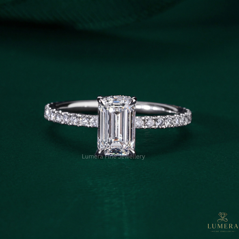emerald cut engagement ring with pave set ring.
