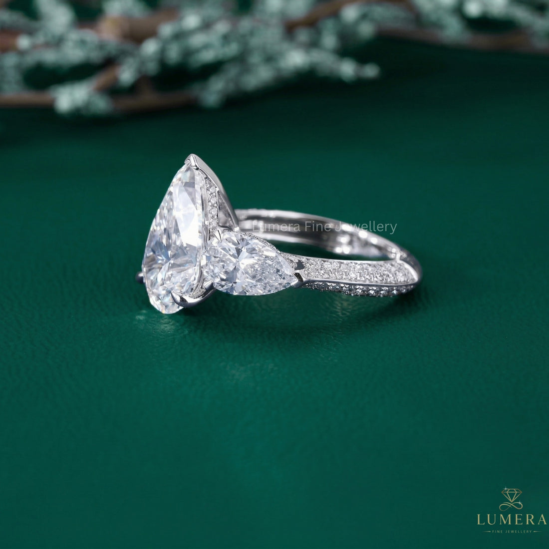 Three Stone Engagement Ring with three stone diamond ring.
