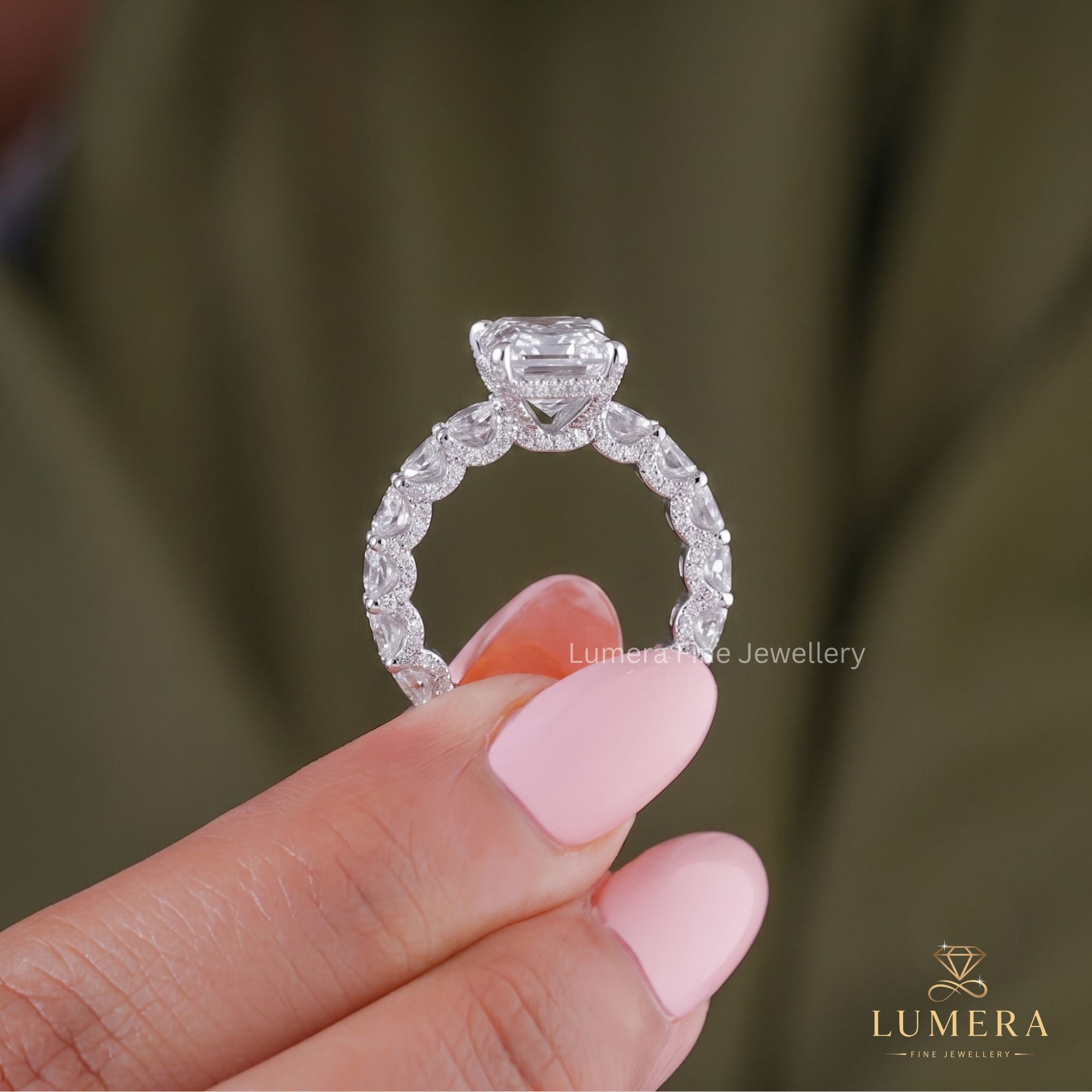 Radiant engagement ring with hidden halo ring.
