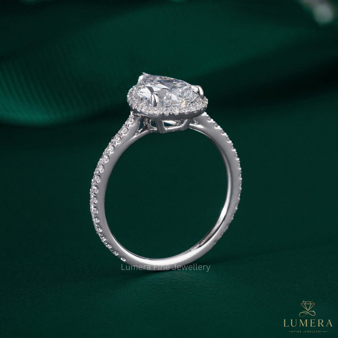 pear cut diamond halo ring with cathedral setting engagement ring.
